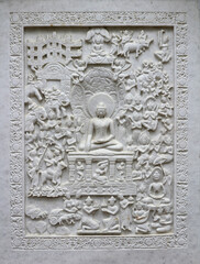 Marble carving in a Buddhist temple, Buddha meditating.