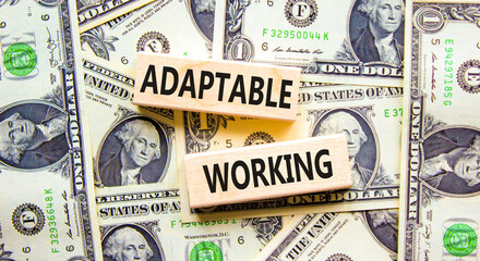 Adaptable working symbol. Concept words Adaptable working on beautiful wooden block. Beautiful dollar bills background. Dollar bills. Business Adaptable working concept. Copy space.