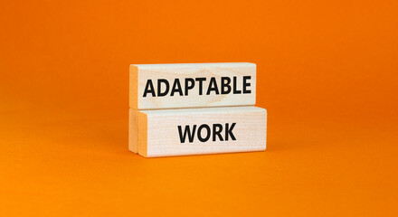 Adaptable work symbol. Concept words Adaptable work on beautiful wooden block. Beautiful orange paper background. Business Adaptable work concept. Copy space.