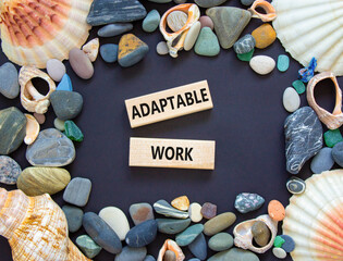 Adaptable work symbol. Concept words Adaptable work on beautiful wooden block. Sea shell and sea...