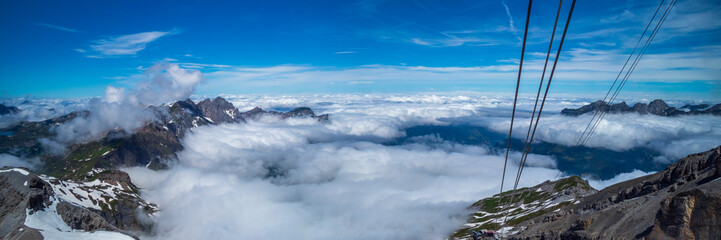 Wide panorama view of the Alps at the top of Titlis Mountain in Switzerland