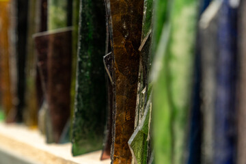 colored broken glass for stained glass art. colored glass sorted and arranged for the art of glass painting