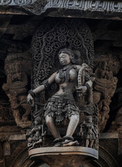 Obraz premium Tiny and intricate carvings, sculptures of the temples of the Hoysala Empire. Belur. India.