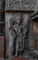 Tiny and intricate carvings, sculptures of the temples of the Hoysala Empire. Belur. India.
