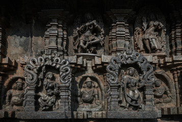 Tiny and intricate carvings, sculptures of the temples of the Hoysala Empire. Belur. India.