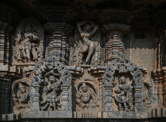 Tiny and intricate carvings, sculptures of the temples of the Hoysala Empire. Belur. India.