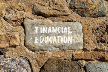 Financial education symbol. Concept words Financial education on beautiful grey stone. Beautiful stone wall background. Business Financial education concept. Copy space.