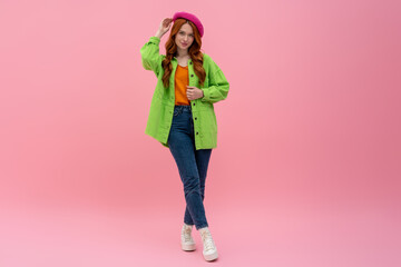 Pretty young woman in bright clothes looking confident