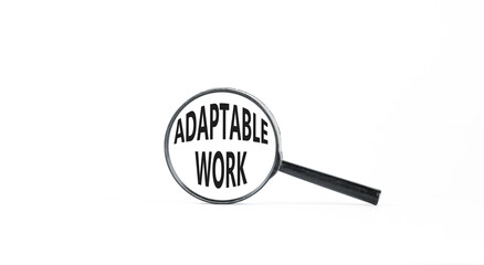 Adaptable work symbol. Concept words Adaptable work in beautiful magnifying glass. Beautiful white paper background. Business Adaptable work concept. Copy space.