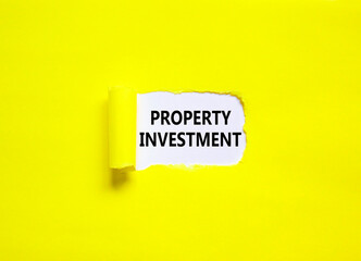 Property investment symbol. Concept words Property investment on beautiful white paper. Beautiful yellow paper background. Business Property investment concept. Copy space.