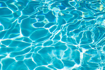 Obraz premium Pool water surface. Blue water texture. Close up blue water surface. Sea surface aerial view. Blue swimming poll water surface. Pattern texture.