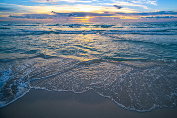 Waves at sandy beach. Seascape. Ocean beach background. Scenic coast view. Sea sunrise water....
