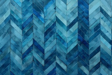 Blue chevron pattern wall background, textured surface with overlapping blue tiles