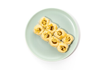 Delicious Baked Sushi Roll with Cheese Cream and Unagi Sauce on Light Plate