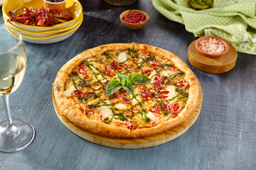 Delicious Margherita Pizza with Pesto Sauce on Wooden Board - Tasty Italian Cuisine