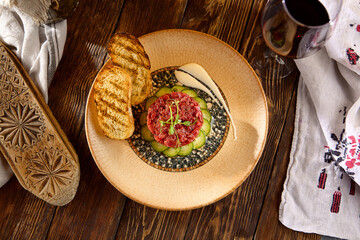 Beef Tartare with Croutons and Cucumbers on Mosaic Plate