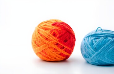 colored balls of wool with a white background