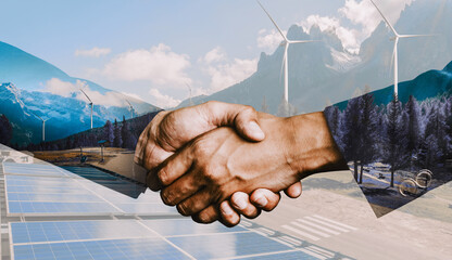 Double exposure graphic of business people handshake over wind turbine farm and green renewable energy worker interface. Concept of sustainability development by alternative energy. uds