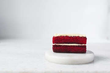 slice of red velvet cake with cream cheese frosting, moist red velvet pound cake with buttercream...