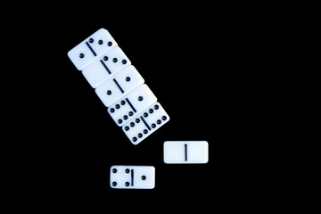 Domino tiles arranged on a black background.