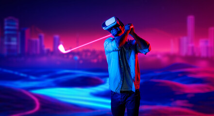 Caucasian man playing golf in metaverse while wearing VR goggles to enter simulated virtual world....