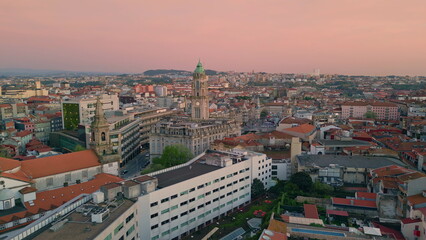 Fototapeta premium Beautiful roof tops aerial view. Peaceful cityscape in sunset vibrant colors