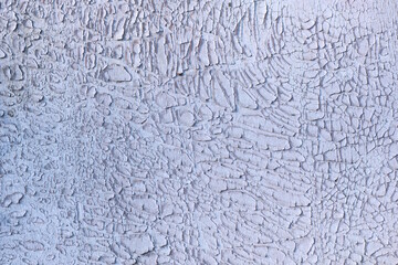 white background of old shabby paint with cracks on the wall