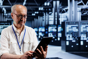 Adept worker in data center providing dedicated VPN servers able to deliver advanced privacy,...