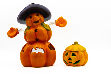 Jack O Lanterns isolated on white background. Ceramic candle holders in the shape of a halloween...
