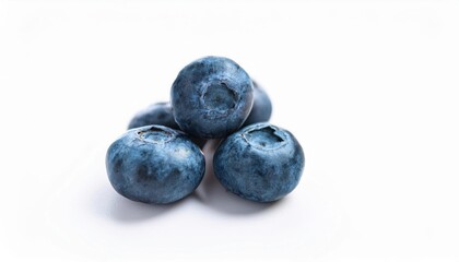 Obraz premium Blueberries Close Up: A small pile of plump, juicy blueberries, captured in a detailed close-up shot, showcasing their vibrant blue color and natural texture. Perfect for food blogs, recipes.