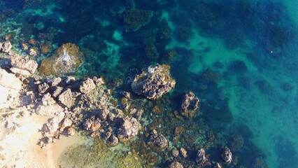 Rocky beach and sapphire sea water on the Maltese island, mediterranean sea, Ghajn Tuffieha bay , Malta. High quality photo