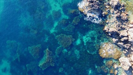 Rocky beach and sapphire sea water on the Maltese island, mediterranean sea, Ghajn Tuffieha bay , Malta. High quality photo