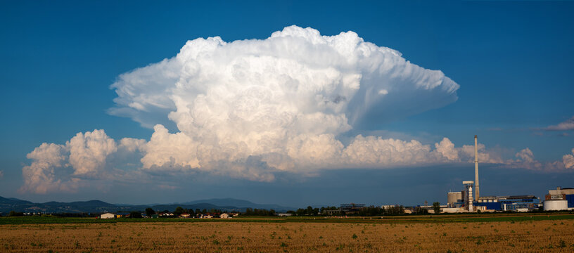 a thundercloud (cumulonimbus) over Grafenau formed into an anvil, Suedzucker factory, Plattling, Lower Bavaria, Germany