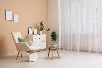 Armchair, coffee table and chest of drawers in living room