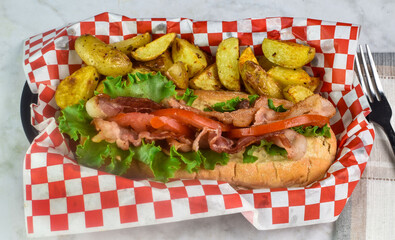 blt  sub  served with potato wedges