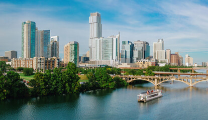 Naklejka premium Bridges crossing the. Colorado River and downtown Austin, Texas, United States.