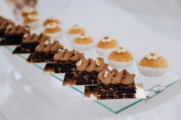 Set of delicious sweet cakes and dessert in the restaurant. Scene is celebratory and festive