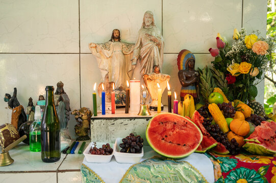 Umbanda altar, a Brazilian religion of African origin, with images, fruits and candles