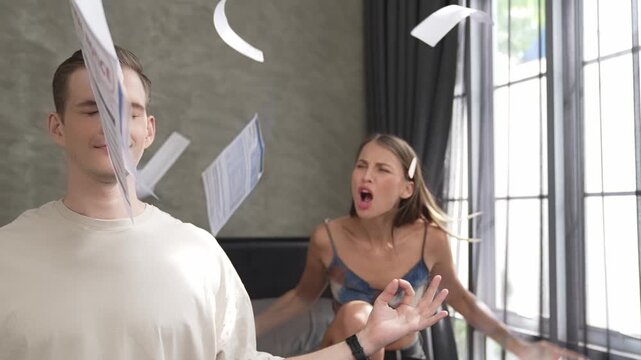 Young man doing mindfulness and peacefulness meditation ignoring problem while his wife or lover yelling with frustrated and upset expression. Marriage problem ignorant lifestyle. Adit