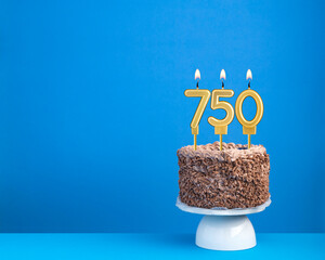 Birthday celebration with candle 750 - Chocolate cake on blue background