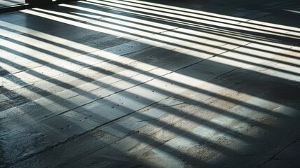 Obraz premium Sunlight streams through a window, casting shadows and creating lines on a wooden floor, adding depth to the modern interior