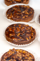 Round walnuts cakes Noix Perigord with walnuts from Dordogne, French sweet desserts