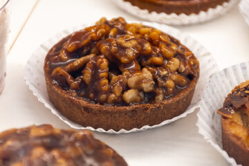 Round walnuts cakes Noix Perigord with walnuts from Dordogne, French sweet desserts