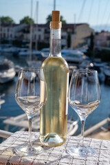 Glasses of cold rose gris Cote de Provence wine in yacht harbour of Port Grimaud, summer vacation on French Riviera in Provence, France, wine tasting