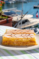 French mille-feuille cake, vanilla or custard slice, Napoleon puff pastry layered with pastry cream served outdoor in Port Grimaud, France