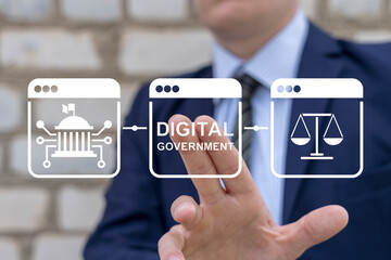 Man using virtual screen presses text: DIGITAL GOVERNMENT. Electronic government concept. Modern governance technologies. Digitalization. Digital transformation public government sector. E-government.