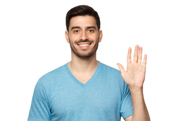 Young smiling man greeting someone with open hand, wearing blue t-shirt © Damir Khabirov