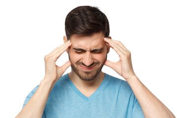 Naklejka premium Young man experiencing severe headache, pressing fingers to temples, keeping eyes closed trying to ease pain, feeling sick and troubled
