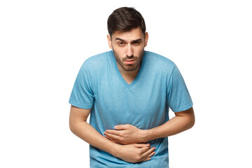 Abdominal pain or ache concept. Young sick man touching his stomach