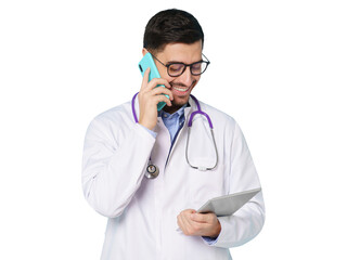 Fototapeta premium Young male doctor standing, looking at tablet screen while talking on phone, discussing patient issues